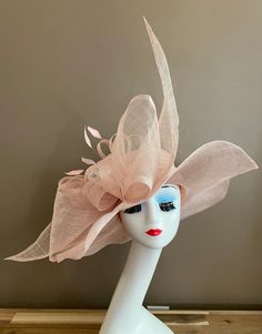 Pale Pink Wide brim sinamay hat with extra-large bow and feathers, elegant, light and comfortable to wear. Head size is about 22.5" unless otherwise requested. All hats include a sizing band to adjust for a comfortable fit.  Key Features: Wide brim Appr: 6-6.5" Head Grith Appr: 22.5" and adjustable to fit sizes smaller than 22.5" Crown Deep Appr: 4.5" Processing Time: 1-3 business days Warm tips:  ❤️Group discount on 3 or more pieces, please contact me for further information on group discount. Elegant Summer Fascinator With Feather Trim, Fitted Feather Trim Hat For Summer, Wedding Wide Brim Feather Trim Fascinator, Wedding Wide Brim Fascinator With Feather Trim, Fitted Wedding Hat With Feather Trim, Fitted Summer Hat With Feather Trim, Fitted Wedding Hats With Feather Trim, Wide Brim Feather Trim Fascinator For Kentucky Derby, Fitted Hat With Feather Trim For Kentucky Derby