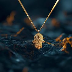 Elevate your style with our 14k Gold Hamsa Hand Pendant. This solid gold necklace showcases exquisite craftsmanship, symbolizing protection and blessings. The 14 karat gold Hamsa Hand pendant is more than just jewelry; it's a fine representation of symbolism and cultural significance, also available in 18k yellow gold. PENDANT INFORMATIONThis pendant is made of real, solid gold.• Made in USA• Material: 14k or 18k solid gold• Finish: polished• Height: 1.25" (31,5 mm) x Width: 0.95" (24 mm)• Penda Amulet Style Pendant Necklace With Charms, Symbolic Brass Necklace With Large Pendant, Gold Amulet Necklace For Good Luck, Symbolic Yellow Gold Oval Pendant Jewelry, Yellow Gold Pendant Jewelry For Blessing, Spiritual 14k Gold Locket Necklace, Spiritual Sterling Silver Necklaces For Rituals, 14k Gold Medallion Necklace In Spiritual Style, Gold Amulet Charm Necklace With Large Pendant