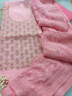 Item Overview ATHARVA Hand Embroidered Salwar Kameez w/Embroidered Neck in Pink/Full Embroidered Georgette Dupatta/Custom Stitching/Wedding/Bridal/ Dno. CH1451 Fabric: * Shirt Chanderi Silk 2.5 Mts, Pink- Embroidered Neck * Dupatta: Georgette Embroidered Dupatta-Hot Pink 2.5 Mts * Bottom Santoon Silk 2.5 Mts. Excusive Hand Embroidered Party Wear Punjabi Suit. Customization: * Fabrics Customization: Designs Can be made in different Fabrics. * Color Customization: Designs Can be made in different Designer Art Silk Sharara With Chikankari Embroidery, Pink Chanderi Dress With Intricate Embroidery, Wedding Embroidered Jamawar Sharara, Pink Chanderi Churidar For Transitional Season, Cotton Wedding Dupatta, Cotton Dupatta For Wedding, Festive Raw Silk Churidar With Chikankari Embroidery, Festive Chikankari Embroidered Raw Silk Churidar, Chikankari Embroidery Raw Silk Salwar Kameez