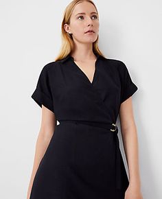 Elevate your wardrobe with the Ann Taylor Crossover Collared Midi Shirtdress, a versatile piece that promises effortless style and comfort. Perfect for a variety of occasions, this dress features a flattering crossover front and a chic point collar.

- **Size:** Regular 00
- **Color:** Black
- **Gender:** Female
- **Material:** Shell: 67% Lyocell, 18% Linen, 15% Viscose; Lining: 100% Polyester
- **Sleeve Length:** Short
- **Length:** 28 inches from natural waist
- **Fit:** Hits below the knee
- Chic Black Belted Dress With Short Sleeves, Collared Belted Shirt Dress For Date Night, Belted Collared Shirt Dress For Date Night, Date Night Belted Collared Shirt Dress, Black Belted Dress With Tie Waist For Work, Black Belted Dress For Summer Formal Events, Spring Black Belted Dress For Daywear, Chic Belted Shirt Dress For Work, Black Belted Dress For Spring Daywear