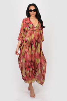 A great kaftan for on holiday over swimwear but looks just as good worn over leggings/shorts and a vest top for garden parties and days in the park. It has a v neck with a cut out on the front and a band that threads through and ties around the body the inside for a flattering shape. Made from a floaty chiffon fabric that falls beautifully around the body. FABRIC: * Man made * Deadstock fabric * Low crease * Light weight SIZING: * One size will fit between 8-16 UK * Model is 5ft 9in and wears th Multicolor V-neck Beach Dress For Day Out, Flowy V-neck Kaftan For Day Out, Chic Printed V-neck Kaftan, Printed Beach Dress For Spring Holiday, Bohemian V-neck Kaftan For Spring, Holiday V-neck Floral Print Beach Dress, Vibrant Print V-neck Kaftan For Beachwear, V-neck Beachwear Cover-up For Day Out, Red Floral Print V-neck Kaftan