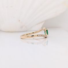 This beautiful classic ring features a Zambian emerald in solid 14k yellow gold. A fancy ring design perfect for an eye-catching engagement or anniversary. This ring also makes a beautiful birthstone ring for your loved ones. This ring is made with solid 14K Gold and naturally Earth-mined SI / G-H diamonds. As listed, this ring is ready to ship. If you're interested in purchasing this setting with a different center stone please message us! Timeless Emerald Cut Birthstone Ring In 14k Gold, 14k Gold Emerald Cut Birthstone Promise Ring, 14k Gold Emerald Cut Promise Ring, 14k Yellow Gold Emerald Ring With Tension Setting, 14k Gold Emerald Promise Ring, May Birthstone, 14k Gold Emerald Ring For Promise, May Birthstone, Emerald Solitaire Ring For May Birthstone, Emerald Cut Stackable Rings With Prong Setting For Promise, May Birthstone Emerald Solitaire Open Ring