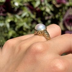 New, but old pieces, never worn, recently acquired from a premier jeweler located in Minneapolis, MN for many years- A rare opportunity! 14KT yellow gold genuine, bezel-set, Mabe pearl ring with Etruscan/ filigree design. Size 6.25 Sizable by us for a fee or your local jeweler Weight: 7.90 grams Band width: 4mm 11mm pearl Stamped 14k Timeless Formal Pearl Ring With Gemstone, Timeless Formal Pearl Gemstone Ring, Timeless Pearl Ring For Formal Occasions, Classic Wedding Jewelry With Cabochon, Elegant White Domed Rings, Formal Baroque Hallmarked Jewelry, Vintage Pearl Ring With Gemstone, Classic Baroque Jewelry For Formal Occasions, Baroque Classic Formal Jewelry