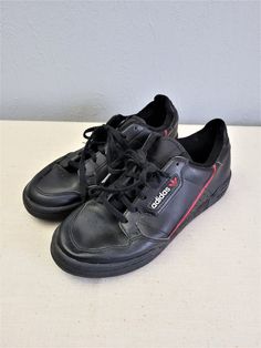 "Black with red and white elements leather lace up women Adidas sneakers. Sport flat shoes. Textile lining inside. Size EU 37. Made in Indonesia. labeled size: EU 37 1/2 / UK 4 1/2 / US 5 / JP 235. Estimated size is EU 37, US 6. condition: normal, used condition. Open a little bit right foot shoe frontal seam, but not practical meaning. measurements: sole heel height 2,5 cm / 0.98\" in outsole length 26 cm / 10.1\" in #s1103" Adidas Logo Leather Lace-up Custom Sneakers, Custom Adidas Logo Leather Lace-up Sneakers, Sporty Lace-up Skate Shoes With Red Sole, Leather Low-top Skate Shoes With Red Sole, Sporty Skate Shoes With Red Sole And Lace-up, Casual Adidas Logo Leather Custom Sneakers, Casual Adidas Logo Leather Sneakers, Casual Adidas Custom Lace-up Sneakers, Casual Leather Skate Shoes With Red Sole