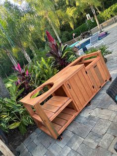 a wooden cabinet sitting on top of a patio