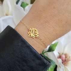 Minimal and Simplistic Style!A meaningful gold lotus flower bloom sits in the center with sparkling Gold Filled chain encircling the wrist. Solid lobster clasp. Your choice of length or you can order it to be adjustable making it easier for gift giving.Just like the Lotus, we too have the ability to rise from the mud, bloom out of the darkness and radiate into the world.All jewelry includes complimentary gift packaging.At Fabulous Creations, all our jewelry is handcrafted in the USA, inspired by Dainty Adjustable Flower Chain Bracelet, Gold Bracelets With Simple Design For Gift, Minimalist Adjustable Flower Jewelry, Dainty Gold Flower Shaped Bracelets, Dainty Gold Flower Chain Bracelet, Adjustable Everyday Flower-shaped Jewelry, Dainty Flower Shaped Chain Bracelet For Gift, Dainty Flower Chain Bracelet For Gifts, Dainty Flower Chain Bracelet As Gift