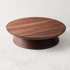 a wooden plate sitting on top of a white counter