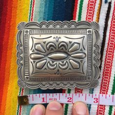 "This piece is a classic rectangular belt buckle with scalloped edges and lovely sterling silverwork. Great gift for an anniversary, birthday or an amazing wedding suit addition for a southwestern vibe. 49 grams for the entire piece 2.4\" long 3\" wide 2\" wide attachment for belt Signed by artist BLKGT and sterling silver hallmark. If you have questions about this item etc please ask before you purchase. Sold as-is, no returns or exchanges on any jewelry. Free domestic shipping Thanks for looki Luxury Belt Buckle With Silver Buckle For Gift, Luxury Vintage Silver Belt Buckles, Artisan Engraved Belt Buckles As Gift, Vintage Silver Concho Belt Buckles, Artisan Engraved Belt Buckles For Gifts, Classic Silver Belt Buckles With Polished Finish, Handmade Artisan Silver Belt Buckles, Vintage Rectangular Engraved Belt Buckles, Vintage Engraved Rectangular Belt Buckles