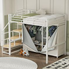 a white bunk bed sitting next to a baby's crib in a room