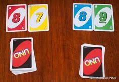 four unopened cards are sitting on a table with numbers in the middle and one number at the bottom