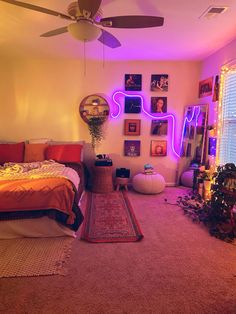 a bed room with a neatly made bed next to a window and a ceiling fan