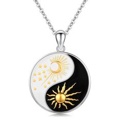 the sun and moon yin yang pendant is shown on a white background with gold stars