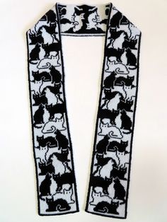 a black and white scarf with cats on it