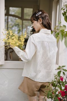 Long sleeve button up shirt in a textured fabric with a peter pan collar with scallop lace trims and embroidered delicate florals along the front. S: 13.5" across shoulders, 36" chest, 22.5" lengthM: 14" across shoulders, 37.5" chest, 22.5" lengthL: 14.5" across shoulders, 39" chest, 23" length White Collared Shirt With Lace Collar, White Shirt With Lace Collar, White Spring Shirt With Lace Collar, Feminine Spring Shirt With Spread Collar, Feminine Spread Collar Shirt For Spring, White Shirt With Lace Collar For Spring, Beige Button-up Blouse With Floral Embroidery, Spring Lace Collar Button-up Shirt, Spring Lace Trim Button-up Shirt