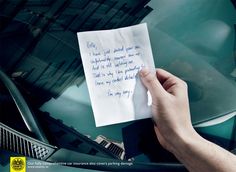 a hand holding up a piece of paper with writing on it next to a car