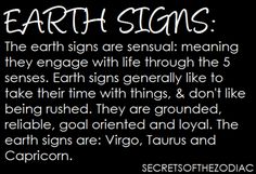 the words earth signs are written in white ink on a black background with an image of two