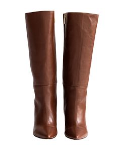 A Bestseller! The Celina Boot by Alma Caso is the quintessential tall boot. Featuring soft brown leather, a pointy toe, chunky heel and interior zipper, you'll want to get this boot in every color! 4 millimeter padding for a bit more comfort. Comes with dust bag. Runs small. Order one full size up. DETAILS 100% LeatherHandmade in MexicoTops measure 13.5 inches3.5 inch heel Brown Calf Leather Knee-high Boots With Pointed Toe, Chic Brown Calf Leather Knee-high Boots, Cognac Calf Leather Heeled Boots For Work, Brown Calf Leather Knee-high Boots With Almond Toe, Cognac Knee-high Boots For Work, Cognac Knee-high Work Boots, Chic Brown Knee-high Boots With Leather Lining, Brown Pointed Toe Knee-high Boots For Office, Brown Calf Leather Boots With Pointed Toe