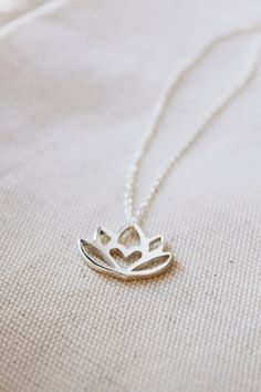 An original Lola&Cash protea necklace featuring a hidden heart— d e t a i l s —-protea measures 2cm wide-hand sawn out of solid sterling silver-completed in a mirror finish-includes a 45cm chainThis pendant is also available in gold as seen in last picturehttps://www.etsy.com/listing/621948340/gold-protea-pendant-solid-9ct-yellow?ref=shop_home_active_1-All Lola&Cash jewellery will arrive gift wrapped>>>——————————<<<>>>——————————<<<Please Note - Made to order - Rush orders can be accommodated upo Elegant Lotus Flower Jewelry Gift, Nature-inspired Silver Heart Necklace, Spiritual Lotus Flower Necklaces For Gifts, Delicate Silver Necklace For Meditation, Spiritual Lotus Flower Necklace Gift, Delicate Small Jewelry Gift, Small Minimalist Necklace As A Gift, Delicate Jewelry For Gifts, Small Minimalist Necklace Perfect For Gifts