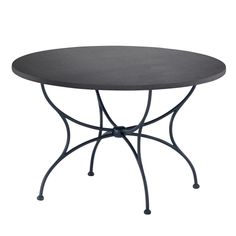 a round table with metal legs and a black top on an isolated white background photo