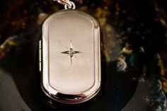 This lovely .925 Sterling Silver Locket is a wonderful way to memorialize your loved ones. It has a Pawprint etched on the surface. 18mm x 20mm Holds about 1/4th a teaspoon of cremains. Please note you add the cremains yourself, no need to send cremains in. Cremains container locks securely into place. We do suggest adding an additional dab of superglue to further secure. ** FREE SHIPPING ON THIS ITEM ** This pendant can be purchased with an optional Rhodium Plated Sterling Silver engraved charm Star Locket, Star Motif, Sterling Silver Locket, Memory Locket, Silver Locket, Silver Lockets, Memorial Jewelry, Small Light, Silver Stars