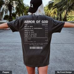 "Layer up in faith with our 'Armor of God' shirt, featuring a unique receipt design that boldly proclaims each piece of spiritual armor.  A perfect conversation-starter that makes a thoughtful gift.  Embrace and share your faith stylishly. Order now!                                 ＊ 𝐍𝐎𝐓 𝐀𝐕𝐀𝐈𝐋𝐀𝐁𝐋𝐄 𝐈𝐍 𝐒𝐓𝐎𝐑𝐄𝐒 ＊ 👚 GET TO KNOW YOUR  ARMOR OF GOD SHIRT This Armor Of God shirt is printed on a Comfort Colors® 1717 Unisex Garment-Dyed Heavyweight T-Shirt with ink using a direct-to-garment printer. They will print your item and send it right to your door!  ✽ 100% Ring-Spun Cotton  ✽ Medium fabric (6.1 oz/sq yd)  ✽ Pre-shrunk  ✽ Soft-washed  ✽ Garment-Dyed Fabric  ✽ Unisex Sizing  ✽ Runs true to size  ✽ Relaxed Fit   ℹ️ Pigment dye refers to washed down colors that continue to s God Plan Shirt, Man Warrior Of God Shirt, Armor Of God Personalized Shirt Wolfantique, Man Warrior Of God Personalized Shirt, Christian T Shirt, Scripture Tshirts, Spiritual Armor, Jesus Paid It All, Armor Of God