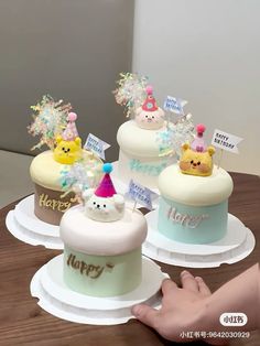 there are three cakes that have been decorated for someone's special occasion, and the cake is on display