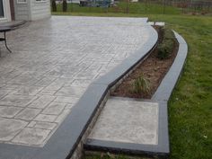 an outdoor patio with steps leading up to it