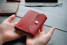 "The original design of the purse, chic red vegetable tanned leather! Wallet size 3.94 × 3.54 inch / 10 × 9 cm. 📍Making You are in the maker's shop 😉 Every wallet is cut and sewn from the very scratch using traditional methods and tools for working with natural leather! 📍Personalization Embossing service you can find in \"OPTIONS\" in every listing. We can emboss almost everything that is needed, company logos, names, phrases, car logos, numbers, dates, and much more) 📍Leather Skin color you can find in \"OPTIONS\" in every listing. We use the highest quality aged cowhide.  It is durable but soft. The torturous nature allows it to age beautifully, mostly by recording the life story of its owner. 📍Production and shipping time We make your item and ship your package in 3-7 business days Red Leather Card Holder With Coin Pocket, Red Leather Trifold Wallet For Daily Use, Red Leather Trifold Wallet For Everyday, Red Leather Wallet With Card Slots, Handmade Red Wallet For Everyday Use, Red Leather Coin Purse With Card Slots, Red Leather Bifold Coin Purse, Handmade Red Wallet, Red Leather Coin Purse With Interior Card Slots