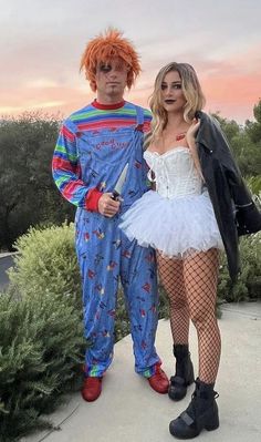 two people in costumes standing next to each other