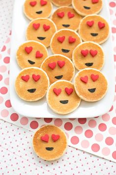 heart shaped pancakes on a plate with hearts in the shape of eyes and nose for valentine's day