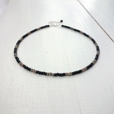 Black And Silver Beaded Necklace, Black Metal Necklace With Silver Beads, Adjustable Gray Necklace With Gemstone Beads, Adjustable Gray Gemstone Beaded Necklace, Adjustable Gray Gemstone Beads Necklace, Black Beaded Glass Necklace, Hand-strung Black Beaded Necklaces, Hand-strung Black Beaded Necklace, Beaded Necklace Black