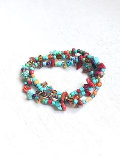 Wrap Handmade colorful Beads Bracelet, Bracelet for teenagers, Bobo Hippie Bracelet, Gifts for her, One of a kind Bracelet. Eclectic bracelet handmade with colorful gemstone, turquoise, red coral, copper findings and glass beads. light and comfortable to wear, avoid water and perfume. Wraps 3 times around 6 to 7 inches wrist. Free shipping with USPS mail, packed and protected in a gift box. Turquoise Multi-strand Wrap Bracelet As Gift, Multicolor Multi-strand Spiritual Beaded Bracelets, Wrap Bracelet Bangle With Spacer Beads As Gift, Multicolor Multi-strand Friendship Bracelets For Beach, Bohemian Wrap Bracelet With Tiny Beads Gift, Bohemian Wrap Bracelet With Tiny Beads As A Gift, Multicolor Beaded Wrap Bracelet For Friendship, Multicolor Beaded Friendship Wrap Bracelet, Adjustable Colorful Bohemian Beaded Bracelets