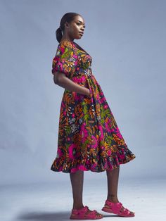 All of Elisamama’s apparel is handmade by a team of artisans in Nigeria. Crafted of pure cotton, his balloon-sleeve Ajoke midi dress is decorated with a twisted bodice and an illustrated floral print. Sweetheart neck Short balloon sleeves Chest cut-out Smocked square back Midi length 100% cotton Hang or dry on low Fit: True to size As with all our products, every purchase allows us to continue to further our mission of supporting our Artisans with Jobs and economic empowerment. Pattern placement Bohemian Midi Dress With Gathered Sleeves, Bohemian Knee-length Midi Dress With Gathered Sleeves, Solid V-neck Midi Dress With Smocked Back, Puff Sleeve Midi Dress With Pleated Details, Knee-length Cotton Puff Sleeve Dress With Floral Print, Fall V-neck Midi Dress With Smocked Cuffs, Chic V-neck Midi Dress With Smocked Cuffs, Summer V-neck Midi Dress With Smocked Cuffs, Short Balloon Sleeves