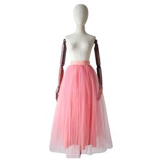 This wonderful 1950's pink tulle petticoat skirt, is the perfect piece to add texture to your vintage wardrobe, or alternatively worn beneath a dress for added volume. The fitted and pleated peach rayon waistband, draws in along the back of the skirt with hook and eye fastenings, beneath a decorative large rayon bow with long length ribbon trims. The pleated and gathered tulle, in two layers, drapes from the base of the waistband along the length of the skirt. Finished with a peach rayon lining. Long Pink Skirt, Tulle Petticoat, Petticoat Skirt, Grecian Dress, Layered Tulle Skirt, Red Velvet Dress, Embellished Jacket, Vintage Wardrobe, Pink Tulle