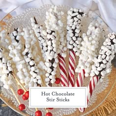 hot chocolate stir sticks on a plate with candy canes