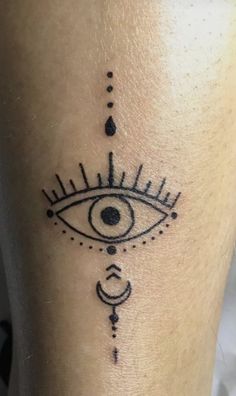 an all seeing eye tattoo on the leg