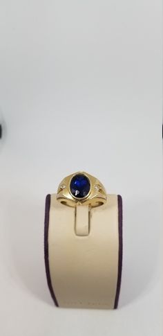 "Vintage 14K Yellow Gold CZ Ring, Size 10. Stamped 14K twice inside band. Blue stone is 10 x 8mm. Weighs 5.4 dwt. Please stop in often as we will be adding additional vintage fine jewelry beauties. Note that the letter/number combo in the title is for our purposes only. We do not check prongs for wear or stones for looseness. All items are sold as is-noting that we are a resale shop so everything here had a previous owner! We will include flaws in the description when noted. This is one of the r Oval Sapphire Signet Ring In 14k Gold, Classic Sapphire Ring Stamped 14k, Formal Oval Sapphire Signet Ring, Formal Sapphire Oval Signet Ring, Oval Sapphire Ring Stamped 14k For Formal Occasions, Formal Oval Sapphire Ring Stamped 14k, Formal 14k Gold Oval Sapphire Ring, Formal Oval Sapphire Ring In 14k Gold, Oval Signet Ring With Prong Setting For Formal Events