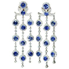 Length：7cm Sapphire：12.61ct Diamond：7.295ct G/H, VS2 Weight: 24.71g _________________________________________ Condition Excellent Comes with Dandelion Antiques Presentation Box _________________________________________ This beautiful blue sapphire chandelier earrings feature blue sapphires and white diamonds. Perfect for a fabulous evening out, these chandelier drop earrings offer sophisticated style and elegance. Crafted in 18K white gold. Showcases 3 rows of round-shape blue sapphires weighing Diamond Chandelier Earrings, Diamond Chandelier, Evening Jewelry, Blue Sapphire Diamond, Beautiful Chandelier, Royal Jewels, White Diamonds, Chandelier Earrings, Pink Sapphire