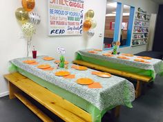 two tables set up with orange plates and green tablecloths for an event or party