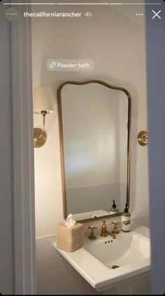 a bathroom sink with a large mirror above it