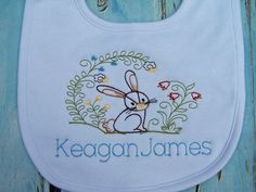 "This adorable baby boy or girl bib &/or burp cloth is the perfect baby gift for that beautiful sweet baby! Can be for a boy or girl. Girl bib and burps cloths have ruffles. The personalized bib &/or burp cloth will be a hit as a baby gift and at your next baby shower! Our premium baby bibs and burp cloths feature an interlock knit top layer, and a chenille terry cloth back layer. . Bibs & burp cloths are available in white, blue and gray for boys. Pink or white with ruffles for girl Cute Handmade White Bib, Cute White Handmade Bib, Cute Personalized Birthday Bib, Cute White Bib For First Birthday, Personalized Baby Bibs, Girls Bib, Burp Cloth Set, Personalized Baby Shower, Burp Cloth