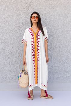 "This beautiful free size Kaftan has a unique presence to it. It's colorful and most importantly comfortable wear, light and soft and can be used on many occasions - home gatherings, dinners, or just in your home to feel comfortable. Fabric : 80% Egyptian Cotton and 20% Polyester Measurements : Free size. Fits up to 4XL. Also there is a belt that can be used to tighten the dress around the hips. Bust size : 67 inches Length : 57 inches **Note : The kaftan in the video is a different color of the White V-neck Kaftan For Spring, White V-neck Embroidered Dress For Festival, White Tunic Kaftan For Vacation, White Chikankari Embroidery Kaftan Tunic, White Tunic Kaftan With Chikankari Embroidery, White Bohemian Tunic With Chikankari Embroidery, White Maxi Length Kaftan For Summer, White Tunic Kaftan For Beach, Traditional White V-neck Maxi Dress