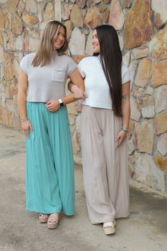 Our "Jordyn Chiffon Pants" are a wide leg chiffon pant. They have a drawstring and elastic waistband. They come in Lilac, Forest Blue, Coral, and Light Mocha. Our model is wearing a size Small. Casual Chiffon Trousers, Casual Chiffon Bottoms With Elastic Waistband, Casual Stretch Chiffon Bottoms, Casual Chiffon Wide Leg Pants, Casual Flowy Chiffon Bottoms, Spring Chiffon Bottoms For Day Out, Flowy Pants With Elastic Waistband For Day Out, Casual Blue Chiffon Bottoms, Flowy Chiffon Bottoms For Vacation