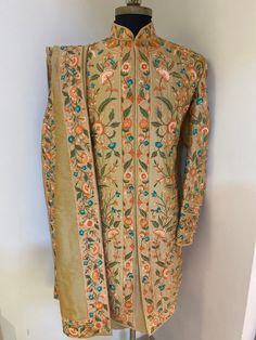 Garb yourself in a stunning masterpiece by Sherwanionline.This sherwani is meticulously handcrafted on a raw silk material in white colour. It has detailed and continuous green thread handwork. It has a mandarin collar which is highlighted with contrasting embroidery in green. This sherwani includes a white churidar bottom and a Matching shawl with 4 sides embroidered.This sherwani not only accentuates your personal style quotient but also fits into everything conventional and heirloom. Includes Raw Silk Sherwani For Traditional Ceremonies, Raw Silk Straight Kurta Sherwani For Traditional Ceremonies, Unstitched Raw Silk Bandhgala With Traditional Drape, Fitted Silk Sherwani For Transitional Season, Silk Sherwani With Zari Work And Traditional Drape, Fitted Silk Nehru Jacket With Traditional Drape, Transitional Raw Silk Sherwani With Dupatta, Traditional Drape Raw Silk Sherwani For Ceremonies, Raw Silk Sherwani With Traditional Drape For Ceremonies