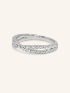 The Criss Cross Diamond Intersecting Ring showcases a modern, sophisticated design with two intersecting bands of 14k gold, each adorned with shimmering diamonds. The crisscross pattern creates a dynamic and elegant look, perfect for adding a touch of sparkle to any outfit. This ring’s contemporary style and radiant diamonds make it a stunning statement piece for any jewelry collection. Elegant Double Band Jewelry With Single Cut Diamonds, Formal Bypass Ring With Modern Twist, Fine Jewelry Double Band Diamond Ring, Modern Twist Open Band Bypass Ring For Formal Occasions, Modern Twist Open Band Diamond Ring, Elegant White Gold Eternity Band With Pave Setting, Formal Double Band Jewelry With Modern Twist, Modern Twist Double Band Jewelry For Formal Occasions, Formal Modern Twist Double Band Jewelry