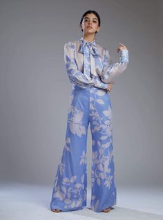 Elegant Blue Sets With Floral Print, Elegant Blue Set With Floral Print, Elegant Blue Floral Print Sets, Blue Long Sleeve Pant Set For Spring, Blue Long Sleeve Pant Set For Work, Light Blue Printed Long Sleeve Set, Elegant Floral Print Pant Set For Spring, Blue Long Sleeve Pant Set For Summer, Blue Printed Pants For Spring