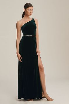 a woman in a black dress with a slit