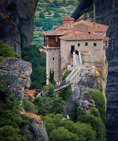 an old building on the edge of a cliff