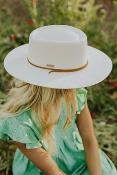 Introducing the Wren - designed with your lifestyle in mind! This flat brim, round top off white hat features a dipped telescope crown adorned with a genuine leather chin strap - to take this hat to the next level! The Wren proves comfort can be stylish and that it’s the details that really matter. White Panama Hat With Short Brim For Rodeo, White Short Brim Panama Hat For Rodeo, White Adjustable Fedora With Flat Crown, Adjustable White Fedora With Flat Crown, White Western Sun Hat With Flat Brim, White Brimmed Panama Hat For Rodeo, White Western Boater Hat With Curved Brim, White Fedora With Curved Brim For Rodeo, White Western Style Sun Hat With Flat Brim