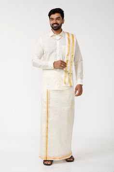 Explore elegance with the VRIKSHAM elite Set, perfect for special occasions and weddings. This ensemble features a Cream Color Art Silk Shirt paired with a Double Dhoti, complete with a Towel, Dhoti Belt, Handkerchief. Material: Art Silk Fit: Smart Fit Sleeve: Full Sleeves Color: Cream Dhoti Length: 4 meters Items Included: Shirt, Dhoti, Towel, Dhoti Belt, Handkerchief Care Instructions: Machine Wash Ramraj Dhoti For Men, Hand Kerchief, Dhoti For Men, Full Sleeve Shirt, Smart Fit, Material Art, Men Store, Vest White, Men Model